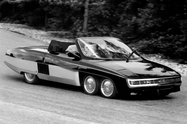 Най-лудият проект на Янкел е шестколесен роудстър със средно разположен двигател на Cadillac. Автомобилът, който поражда асоциации с триосната формула Tyrrell P34, има оригинална каросерия и външни панели, както и независимо окачване на всички колела. Дължината на достигна 4870 мм, ширината и височината - съответно 2030 и 1220 мм. Четирите предни колела, обути в гуми 205/40 R13, реагират на волана. Задната двойка колела е оборудвана с по-широки гуми с размер 265/50 VR16.

Зад седалките е монтиран гигантски 8,2-литров V8, който се появява в гамата на Cadillac през 1970 г. и до 1975 г. се поставя изключително на Eldorado. Британците прикрепват два турбокомпресора към G8, което води до 608 к.с. Отнема по-малко от пет секунди на роудстъра с тегло 1302 кг, за да ускори до 100 км/ч, а максималната скорост е над 320 км/ч. Но дори и такива цифри не могат напълно да оправдаят безумната цена от &pound;39 950. През 1977 г. най-скъпите Ferrari и Lamborghini са били с около 40% по-евтини. И са направени и продадени само две бройки &ndash; различни по външен вид и интериор, местоположението на волана и някои дизайнерски характеристики. Според слуховете и двете коли са &bdquo;живи&ldquo;.